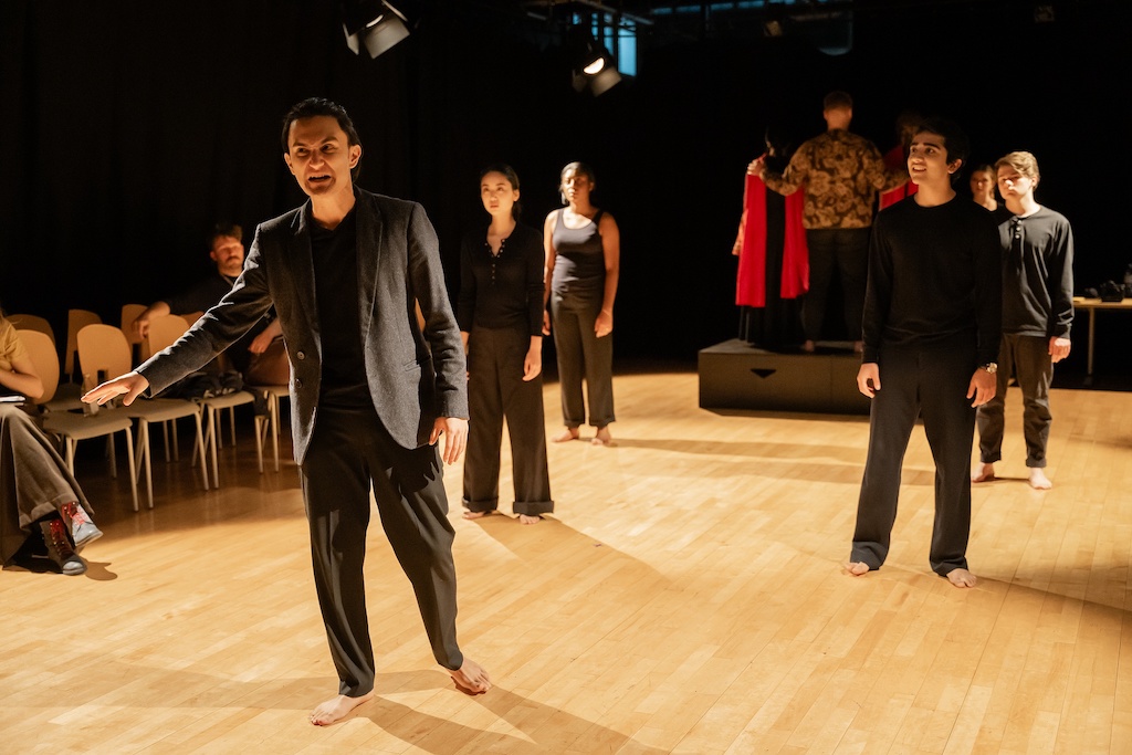 Several actors stand apart from one another in mid-performance during the final presentation of The Winter's Tale.